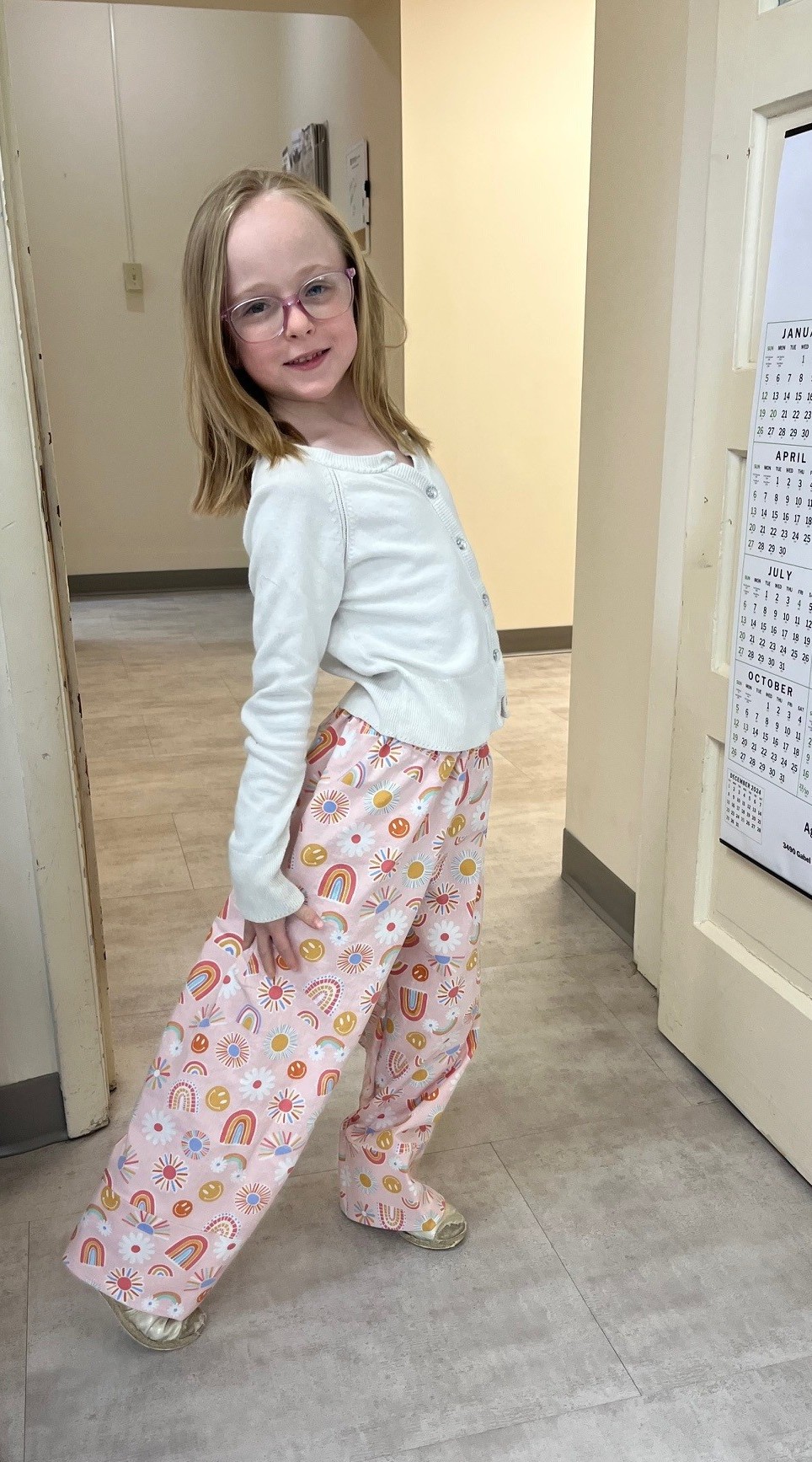 Youth modeling the pants she made in 4-H